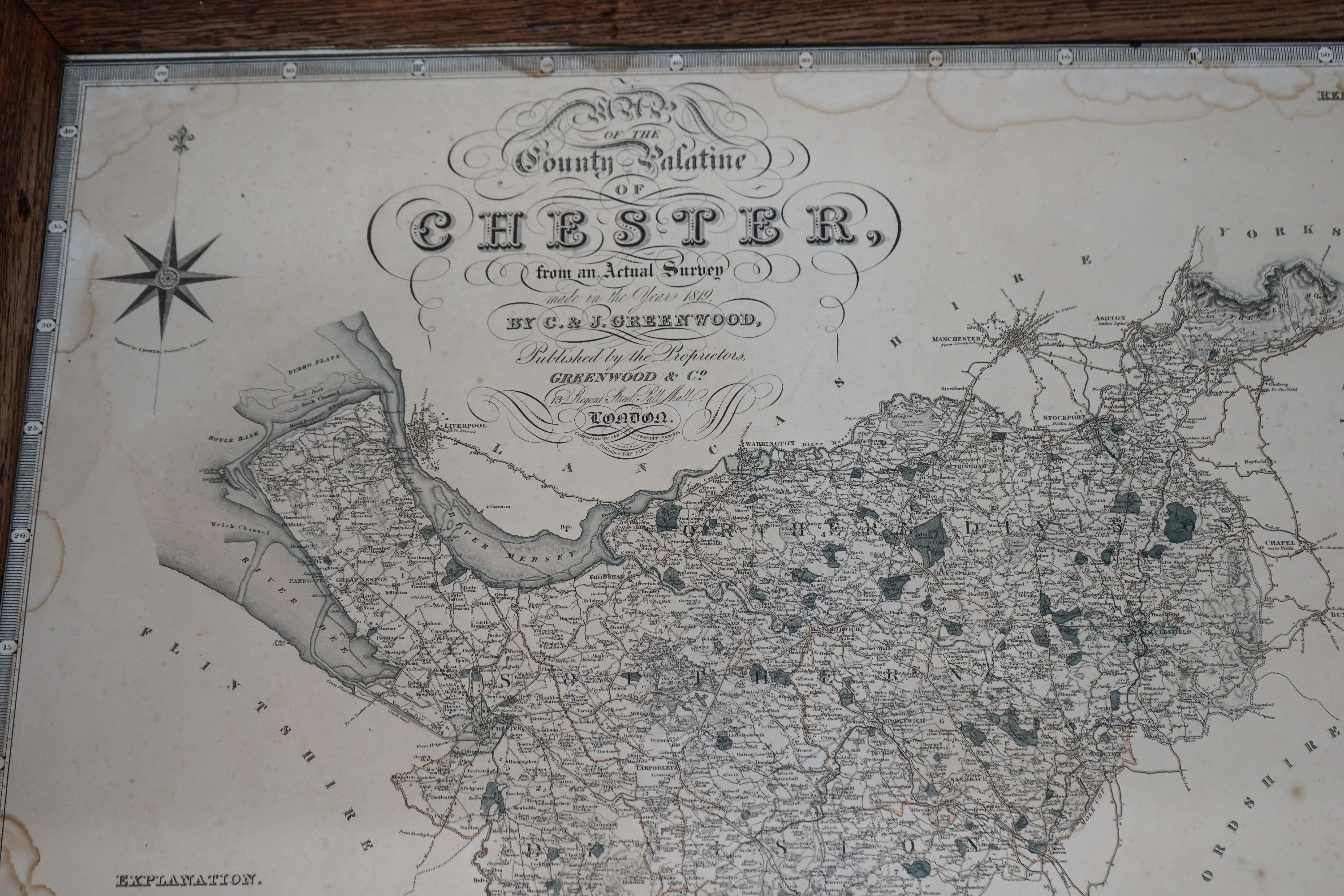 A rectangular oak tray top low table inset with a map of Cheshire on ball and claw stand, width 80cm, depth 70cm, height 48cm